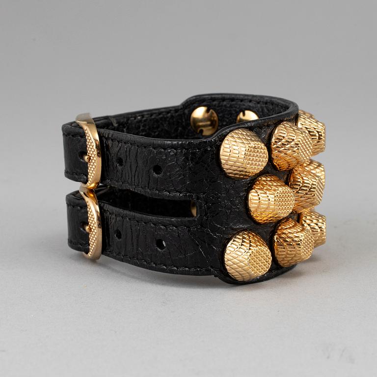 BALENCIAGA, a studded leather bracelet.