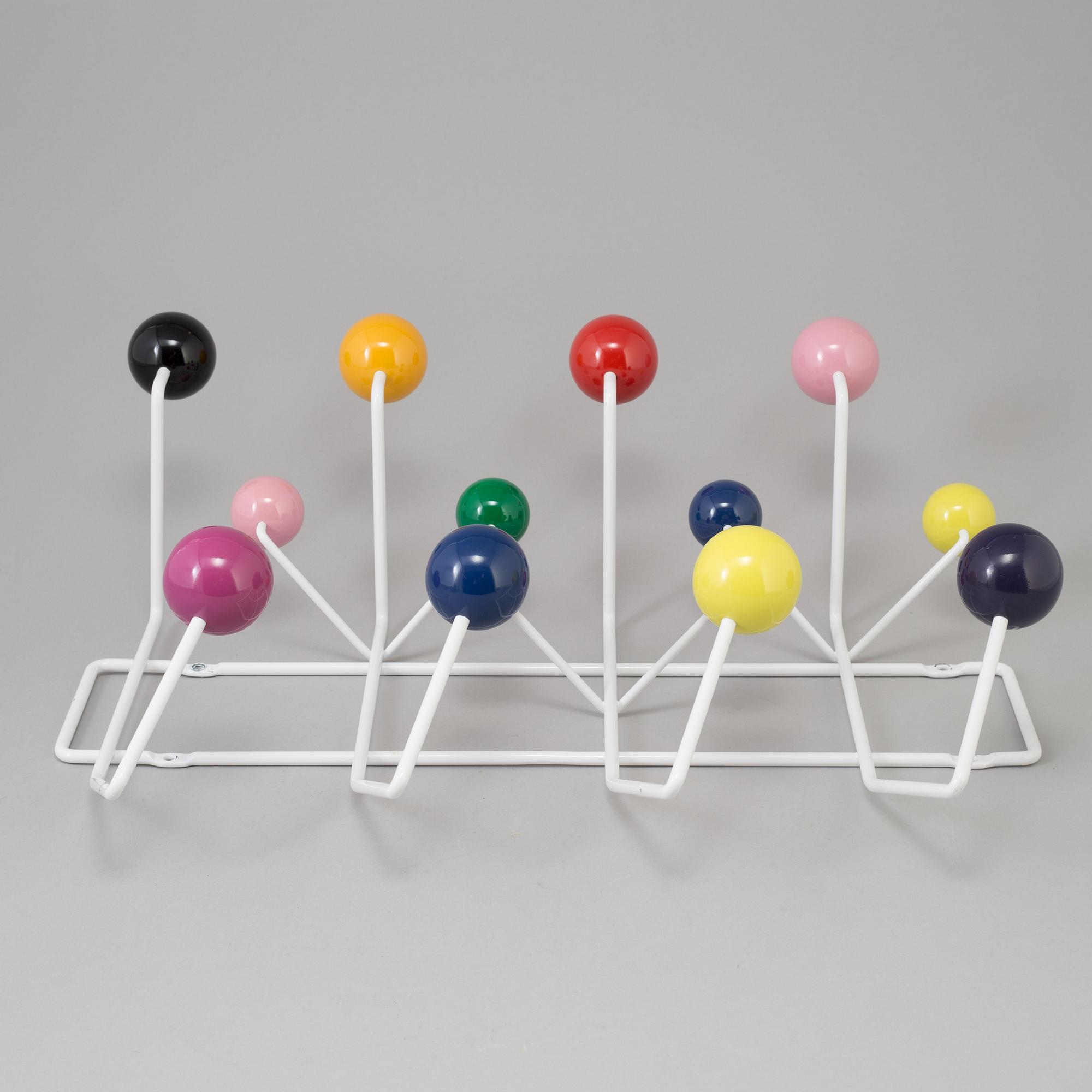 a "Hang it all" clothes hanger by Charles & Ray Eames for Vitra.