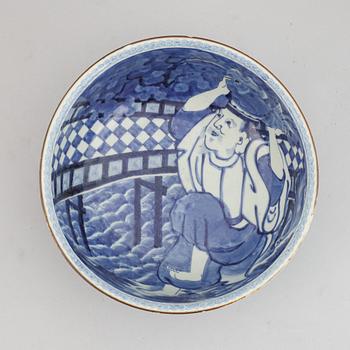 A Japanese blue and white stoneware bowl around the year 1900.