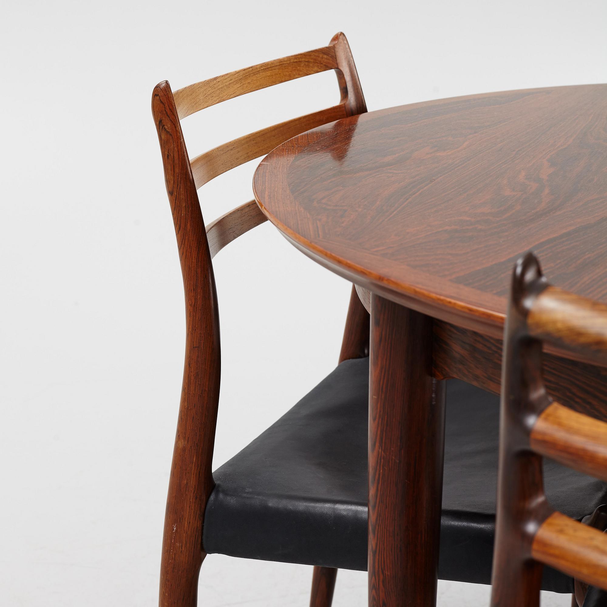 Niles Otto Møller, a rosewood veneered table with four chairs, JL Møller, Denmark, 1950's/60's.