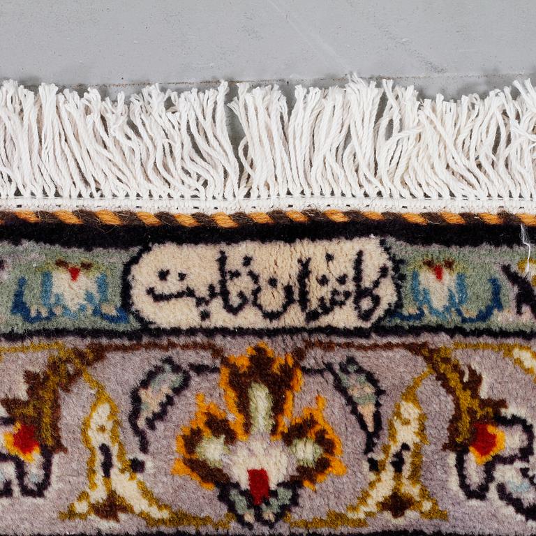 A Keshan rug, signed, 408 x 298 cm.