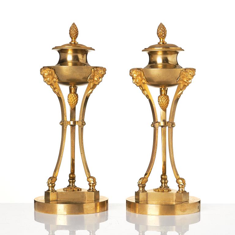 A pair of Empire tripod shaped casolettes.