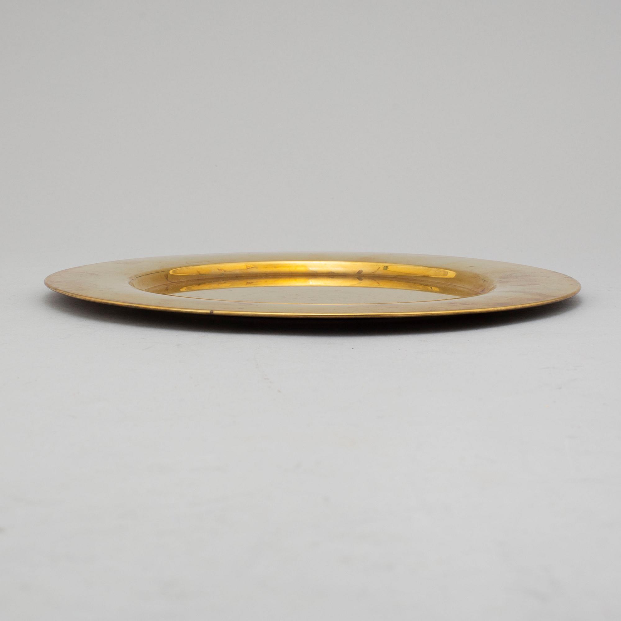 12 brass plates by Stelton, Denmark, second half of the 20th century.