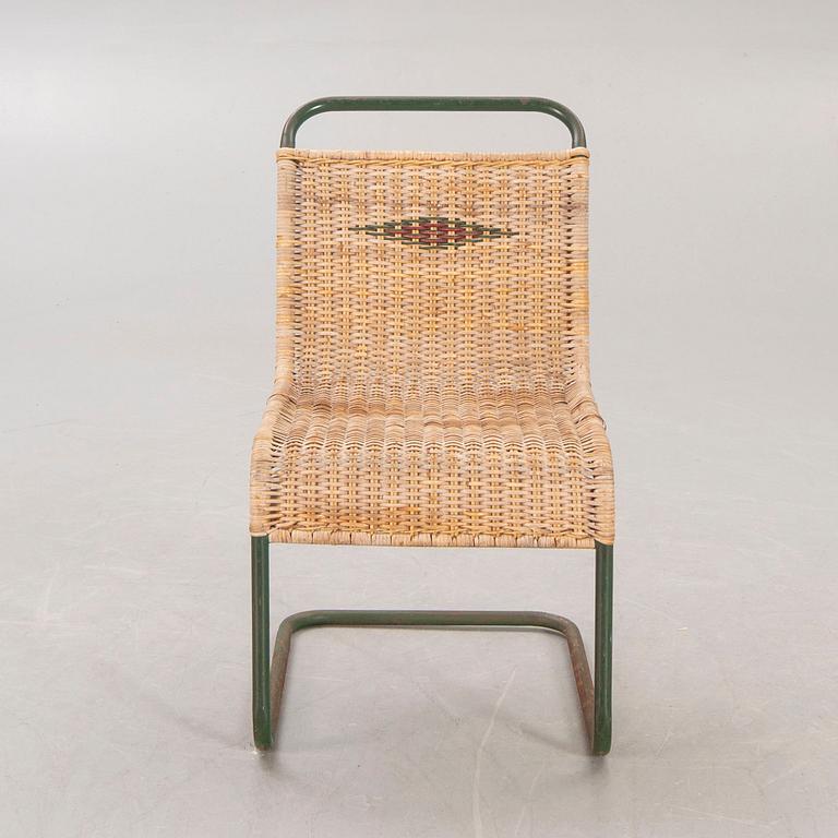 A 1930s braided rattan and metal chair.