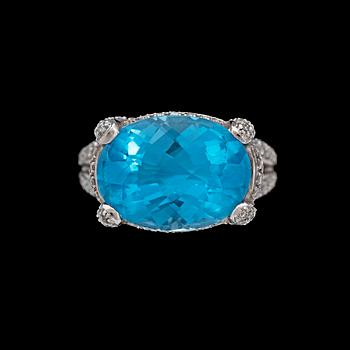 1031. RING, fasettslipad topas med åttkantslipade diamanter, tot. ca 1.20 ct.