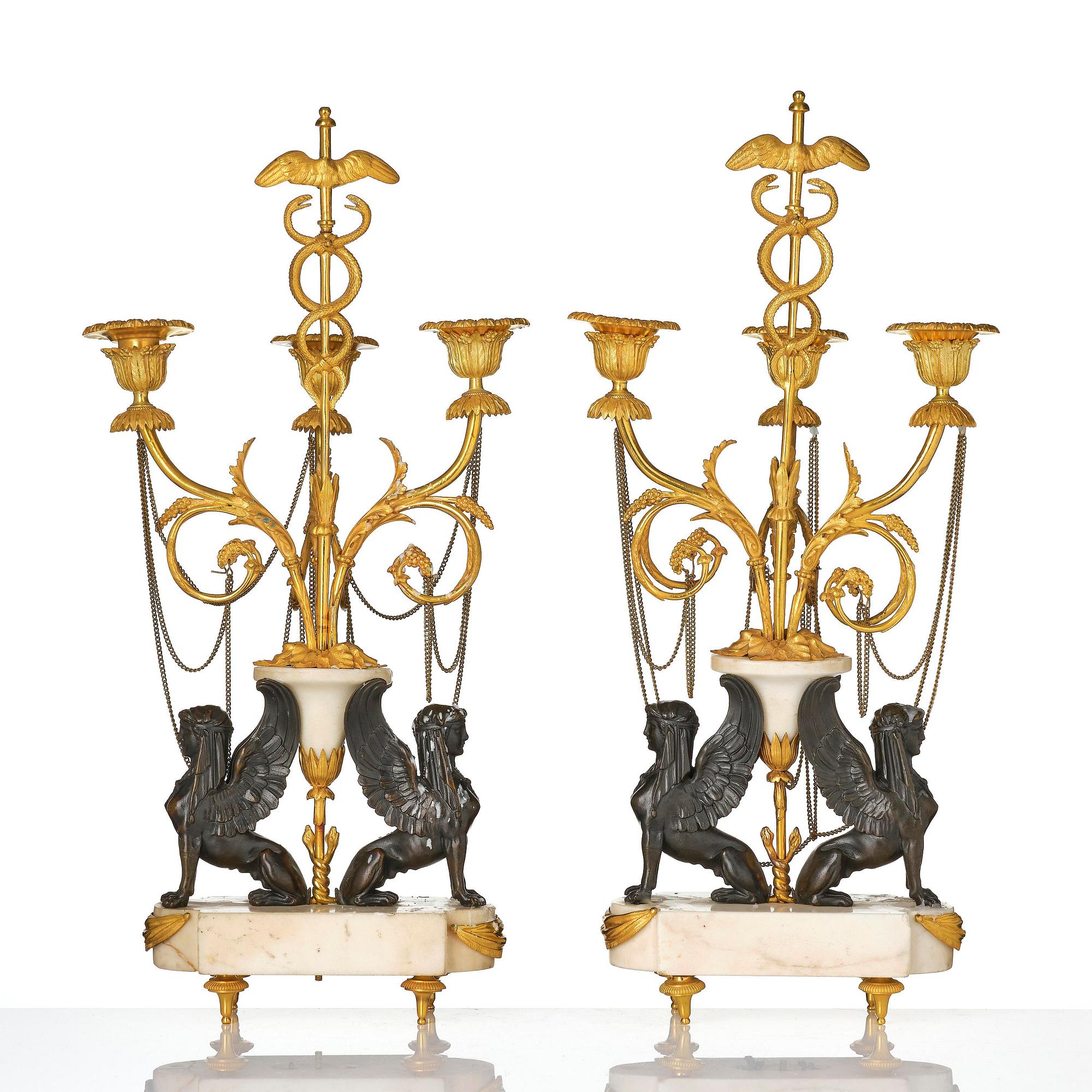 A pair of Louis XVI three lights Candelabra, Parisian works, in the manner of François Rémond, late 18th century.
