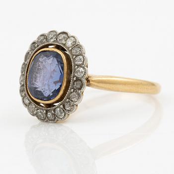 A ring in gold with a cushion-cut purple sapphire and old-cut diamonds, ca first half of the 20th century.