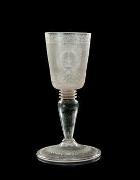 718. A late barocque engraved armorial goblet, first half of 18th Century, presumably Kungsholms glasbruk.