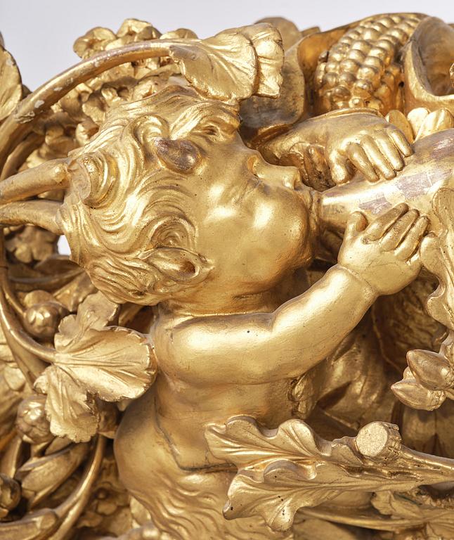 A presumably Dutch Louis XIV carved giltwood frame with mirror glass, in the style of Jean Le Pautre, late 17th century.