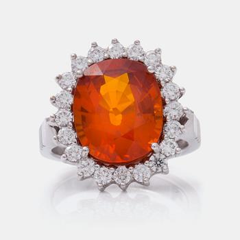 651. A circa 7.50 ct fancy orange sapphire and brilliant-cut diamond ring.