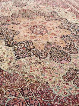 An antique Kerman Laver carpet, c. 586 x 385 cm.