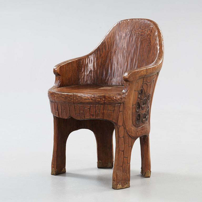 A Gustaf Fjaestad Art Nouveau carved pine chair 'Stabbestol', executed by Adolf Swanson, Arvika, Sweden 1908.