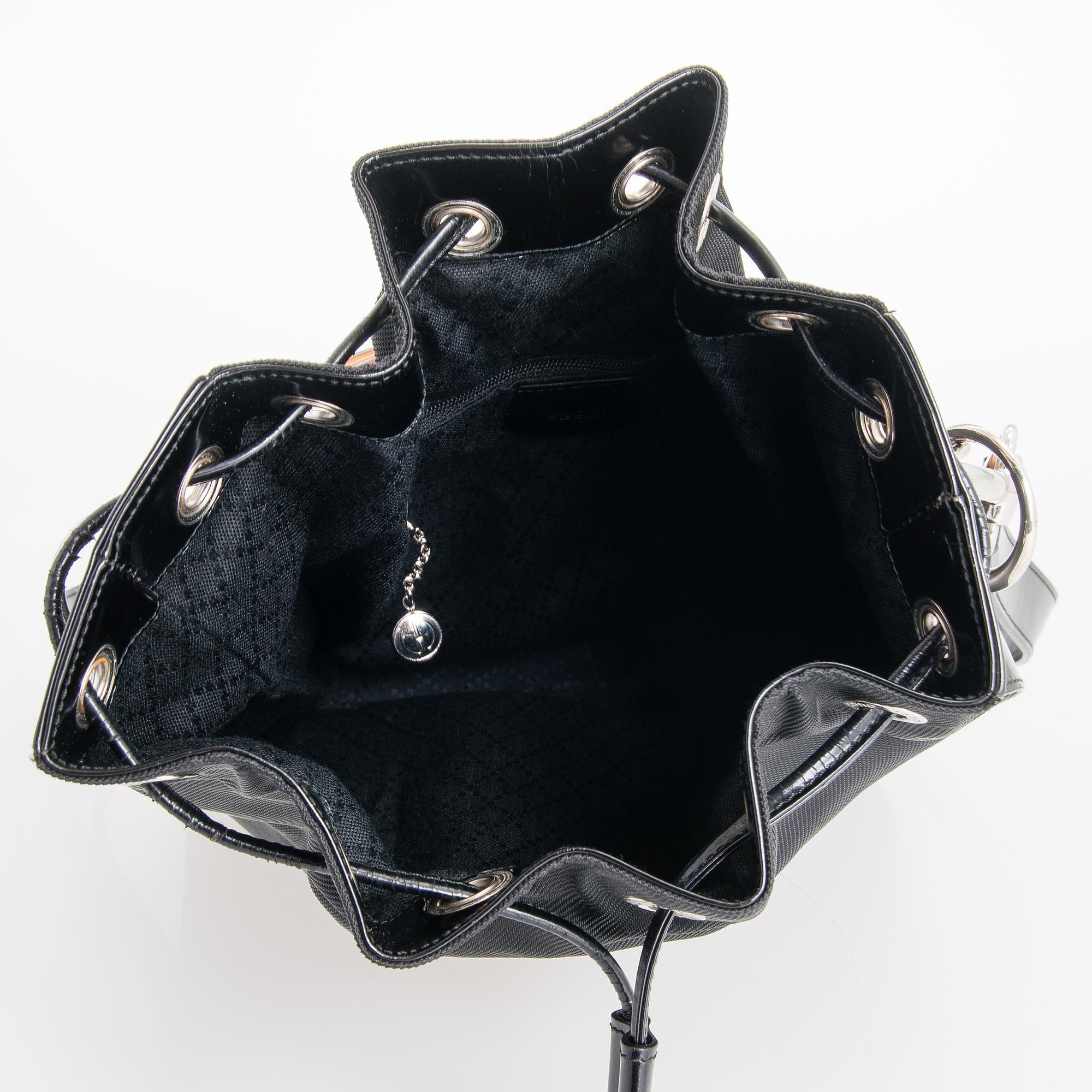 GUCCI, a black nylon handbag.