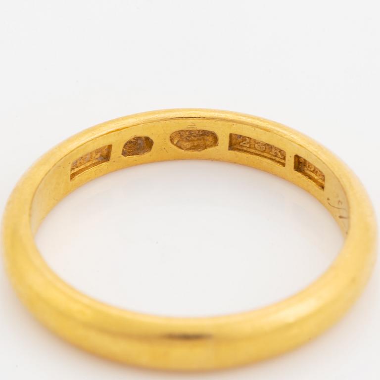 23K gold ring.