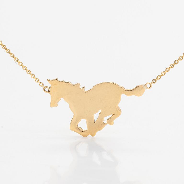 An 18K gold horse necklace. Tillander, Helsinki.