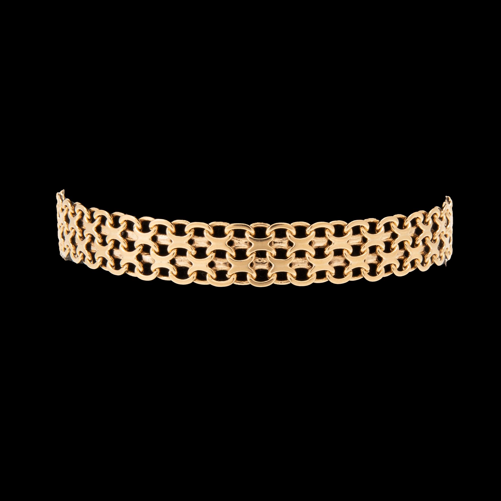 An 18K gold x-link bracelet.