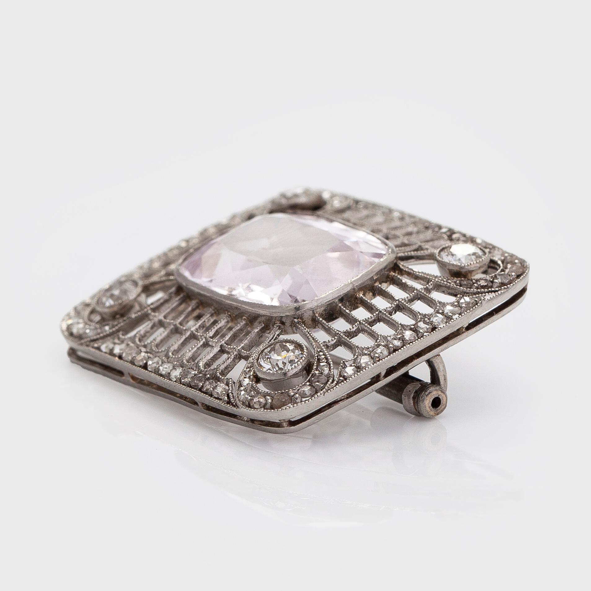A platinum brooch with morganite and old cut diamonds.