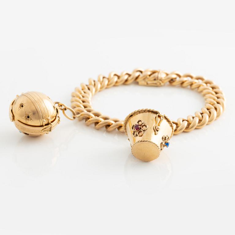 Bracelet, 18K gold with two large charms.