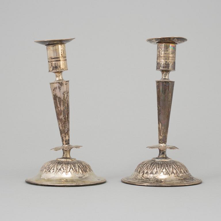 A pair of empire silver candles, presumably Stockholm, dated 1819.