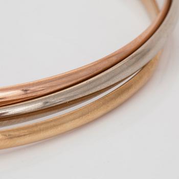 A Cartier "Trinity" bangle. 3 rings.