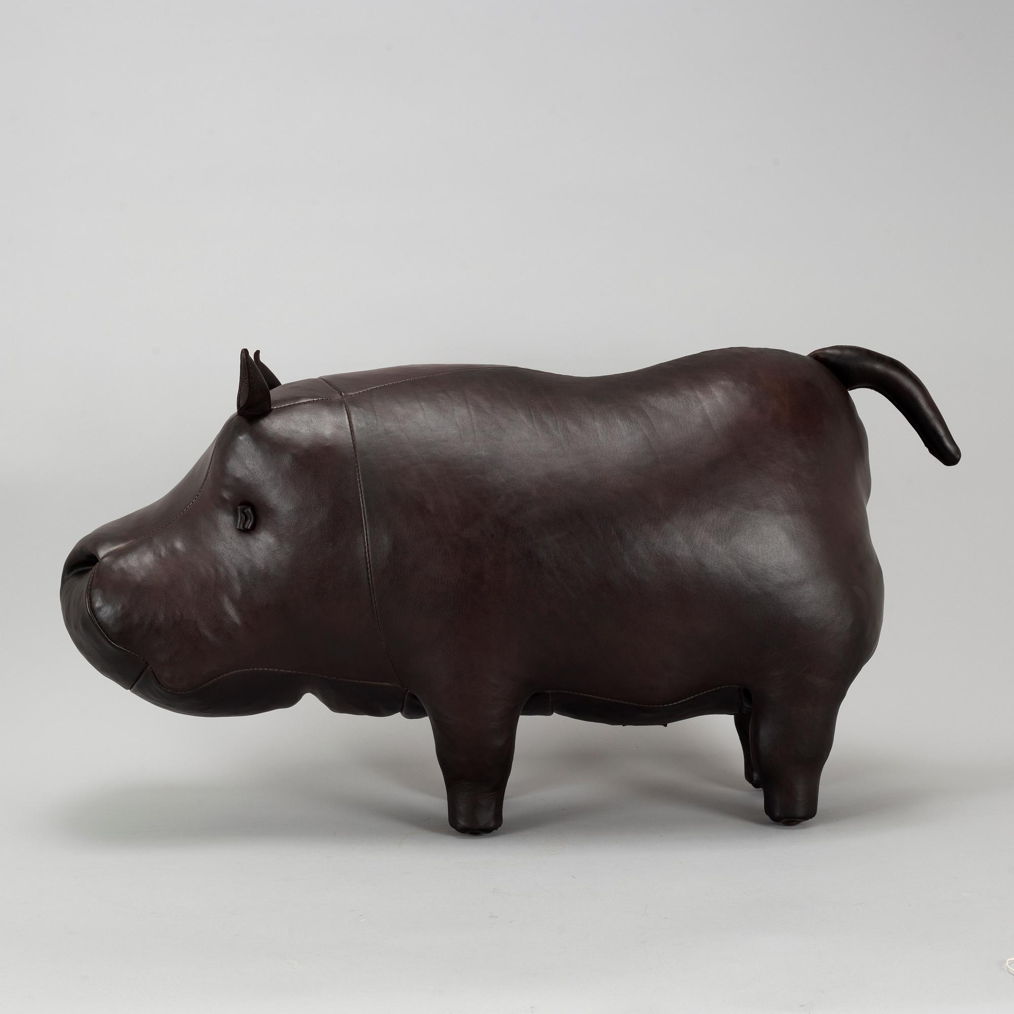 A leather footstool by Dimitri Omersa & Co.