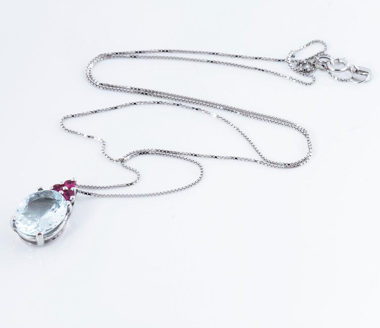 A aquamarine and ruby pendant.