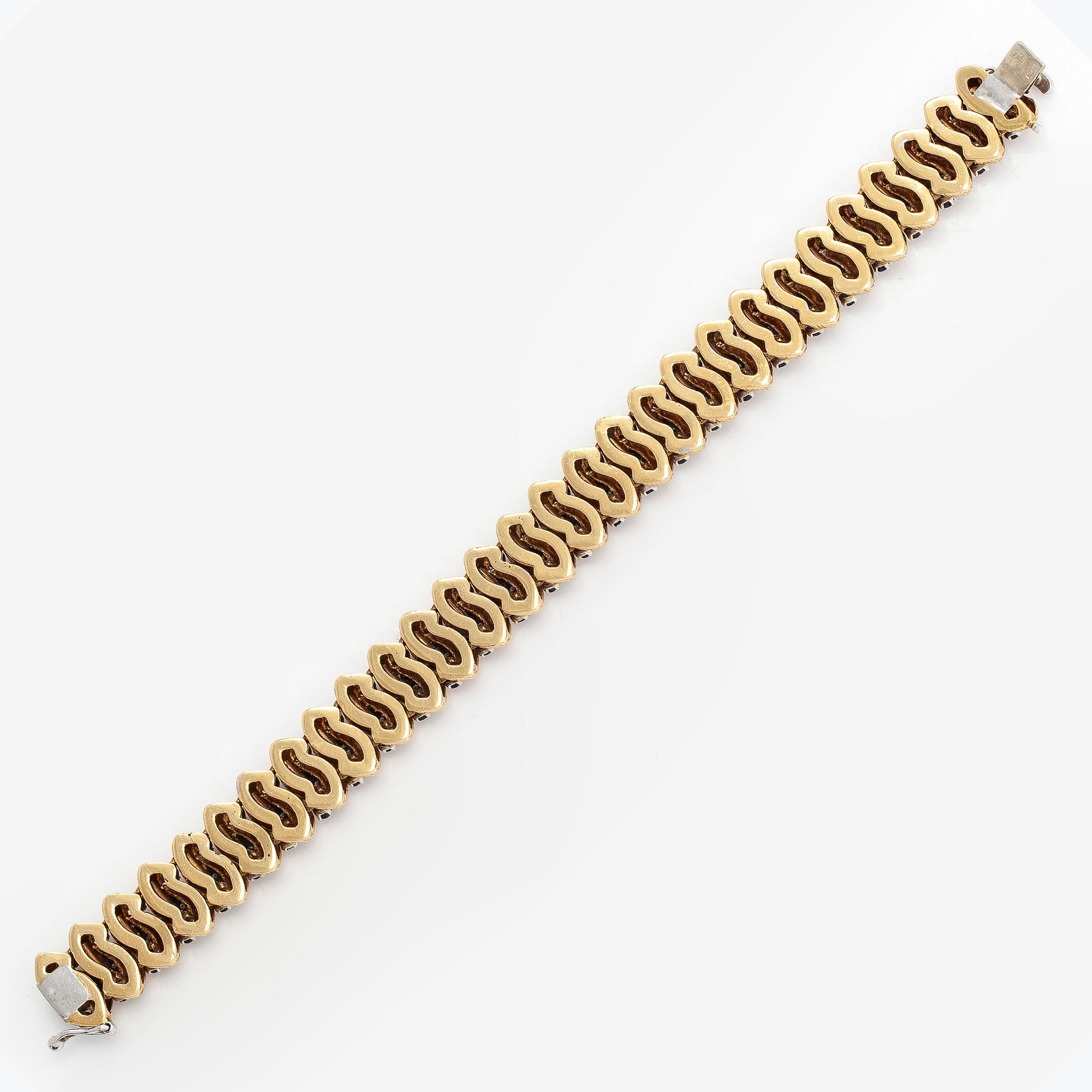 An 18K gold bracelet, diamonds approx. 0.14 ct in total and sapphires, Italy. Finnish import marks.