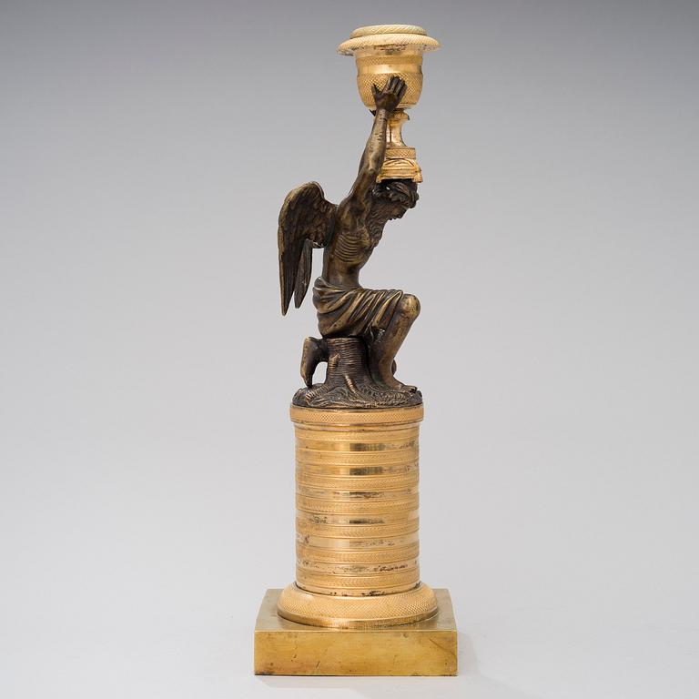 A ORMOLU CANDLESTICK, bronze and gilded bronze, empire early 19th century.