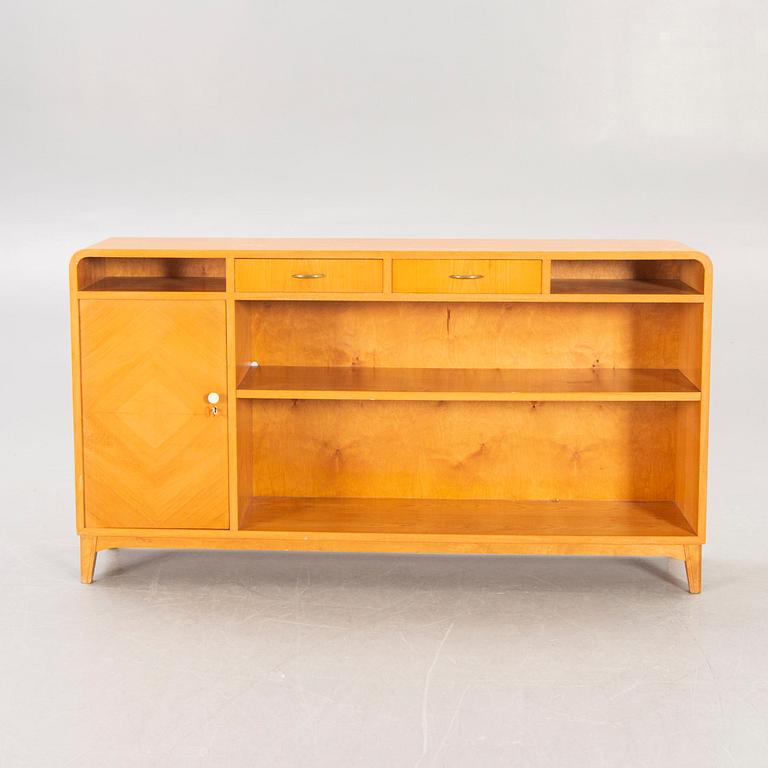 A 1940s birch book shelf.