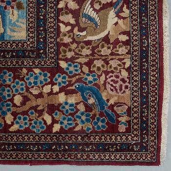 A RUG, a semi-antique Esfahan probably, figural, ca 214,5 x 137,5 cm.