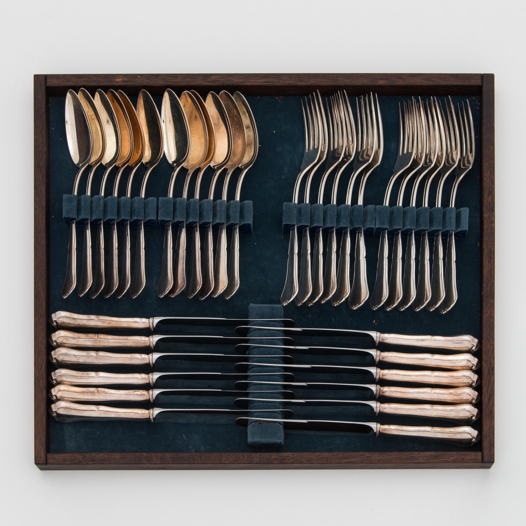 An 82-piece 'Chippendale' silver cutlery set for 12, in cutlery box, Auran Kultaseppä oy, Turku, Finland 1986-87.