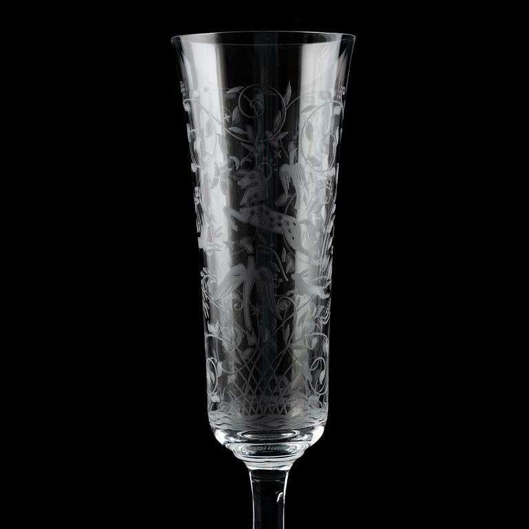 A set of 18 champagne flutes, engraved with animals and leafwork, 20th century Europe .