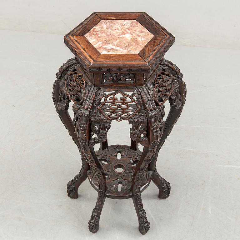 A Chinese carved wood pedestal, 20th Century.