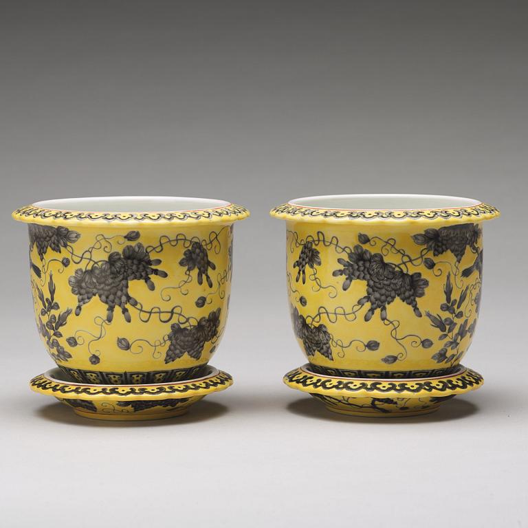 A pair of yellow glazed Dayazhai mark flower pots with stands, Republic, 20th Century.