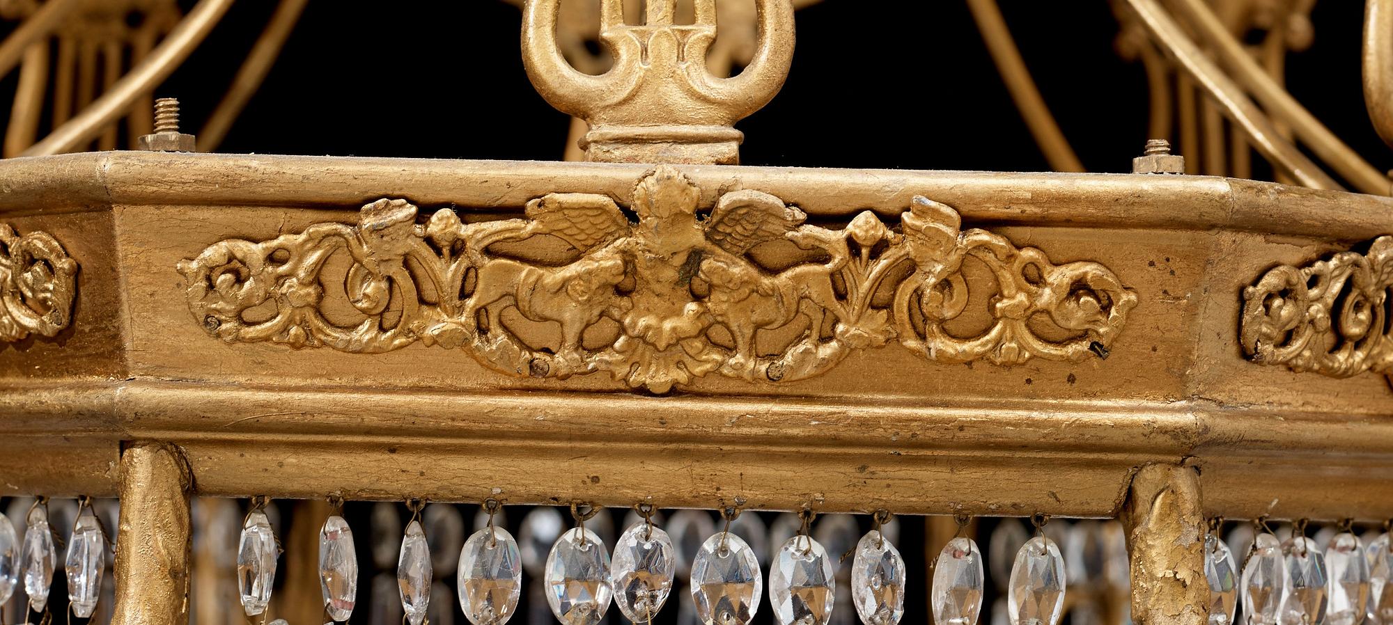 A German 19th century sixteen-light chandelier in the manner of Karl Friedrich Schinkel.