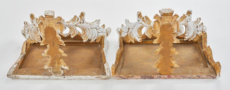 A pair of French Louis XVI-style consoles, late 19th century.