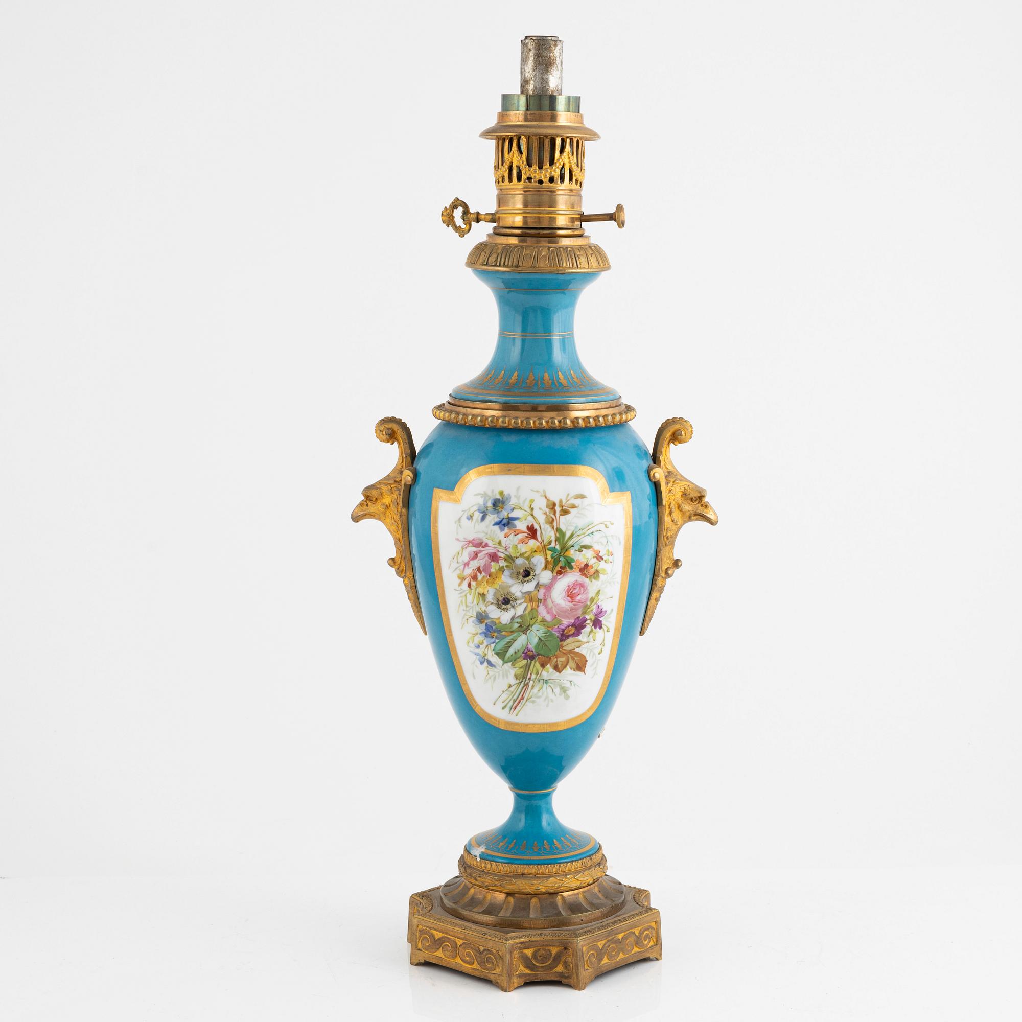 A gilt-brass and porcelaine Louis XVI-style kerosene lamp, later part 19th century.