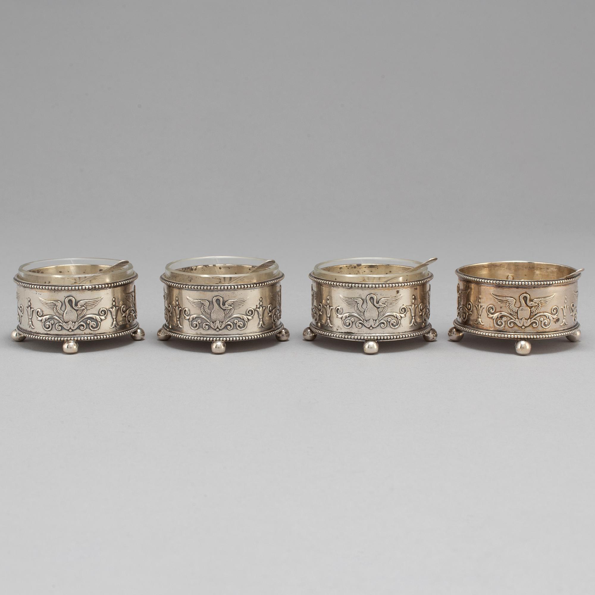 A set of four Fabergé salt-cellars and spoons, marked Moscow 1908-1917. Imperial Warrant.