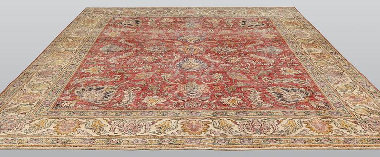 An oriental 'vintage' carpet, c 320 x 295 cm.