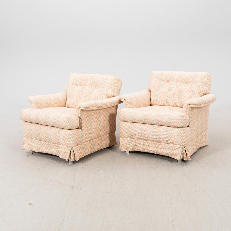 A pair of DUX 1960770s armchairs.