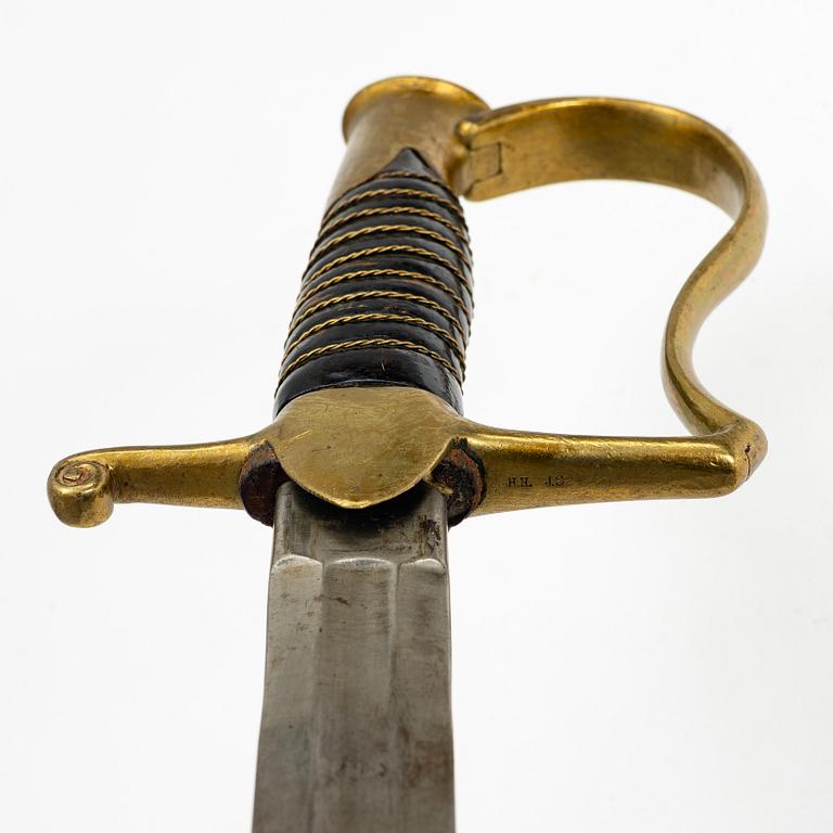 A Swedish artillery saber 1889 pattern with scabbard.