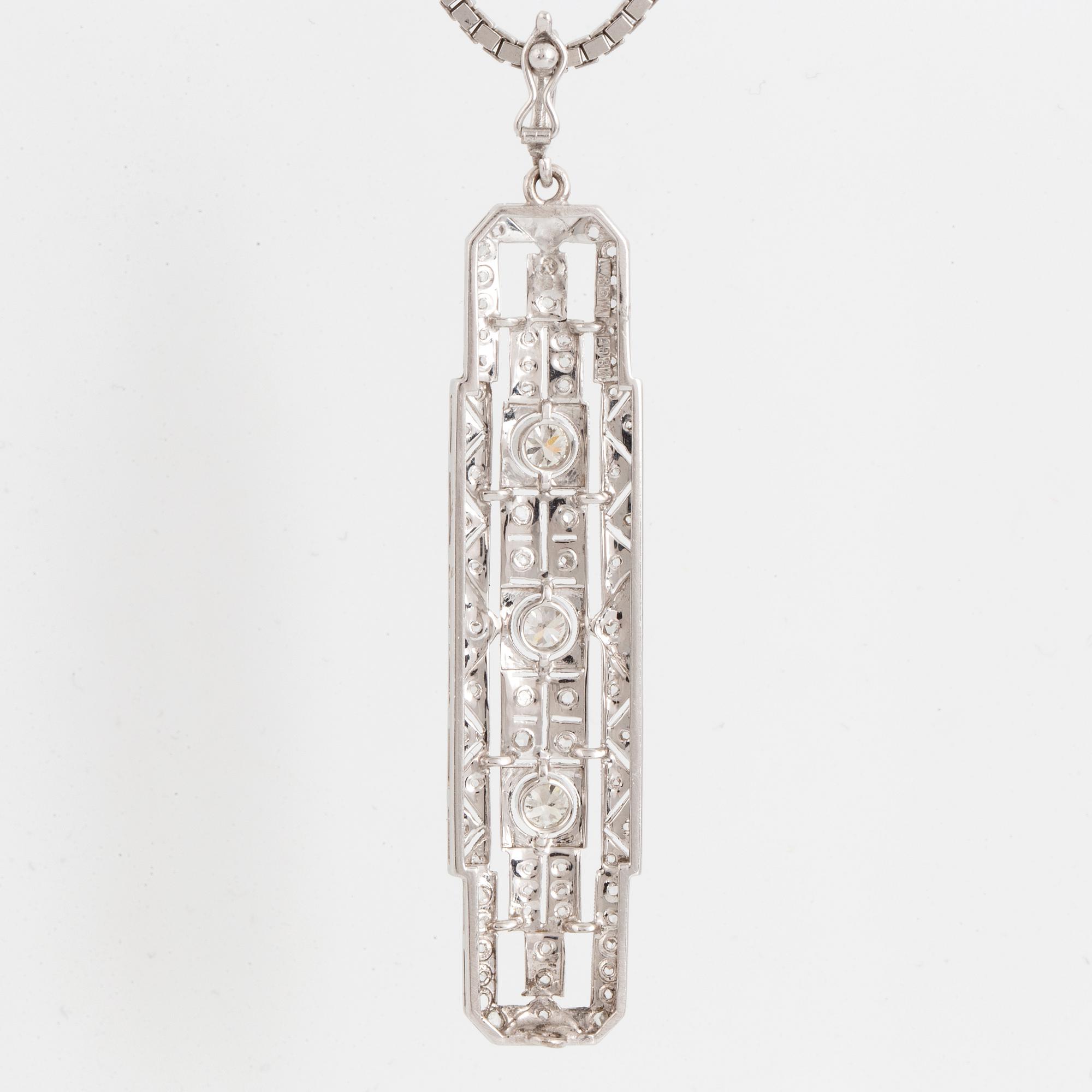 An 18K white gold pendant set with round brilliant- and.