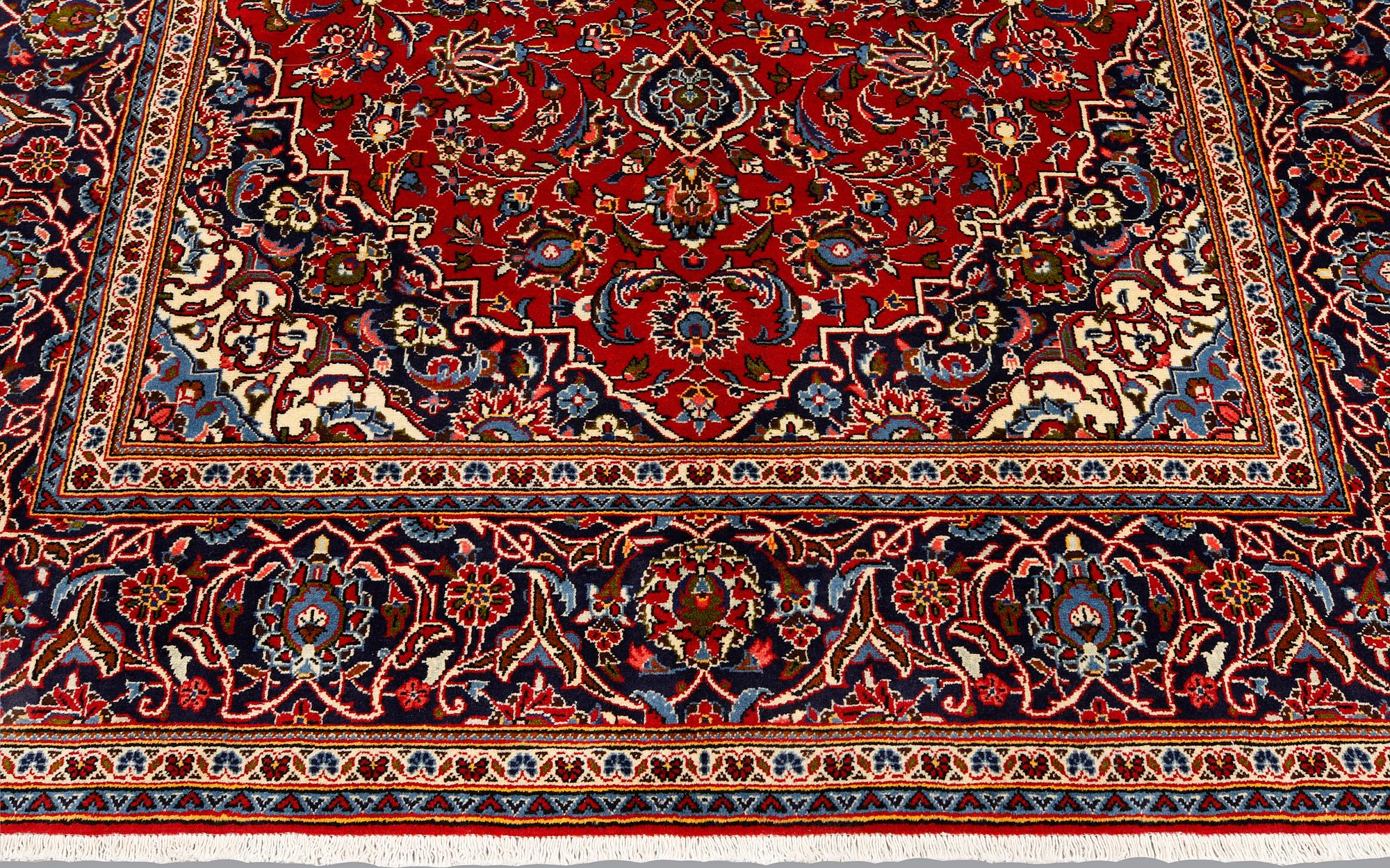 A Keshan rug, approx. 307 x 195 cm.