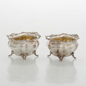 Black Starr & Frost, a pair of sterling silver shakers and sugar bowls, USA around 1900, Gorham pair of sterling spoons.