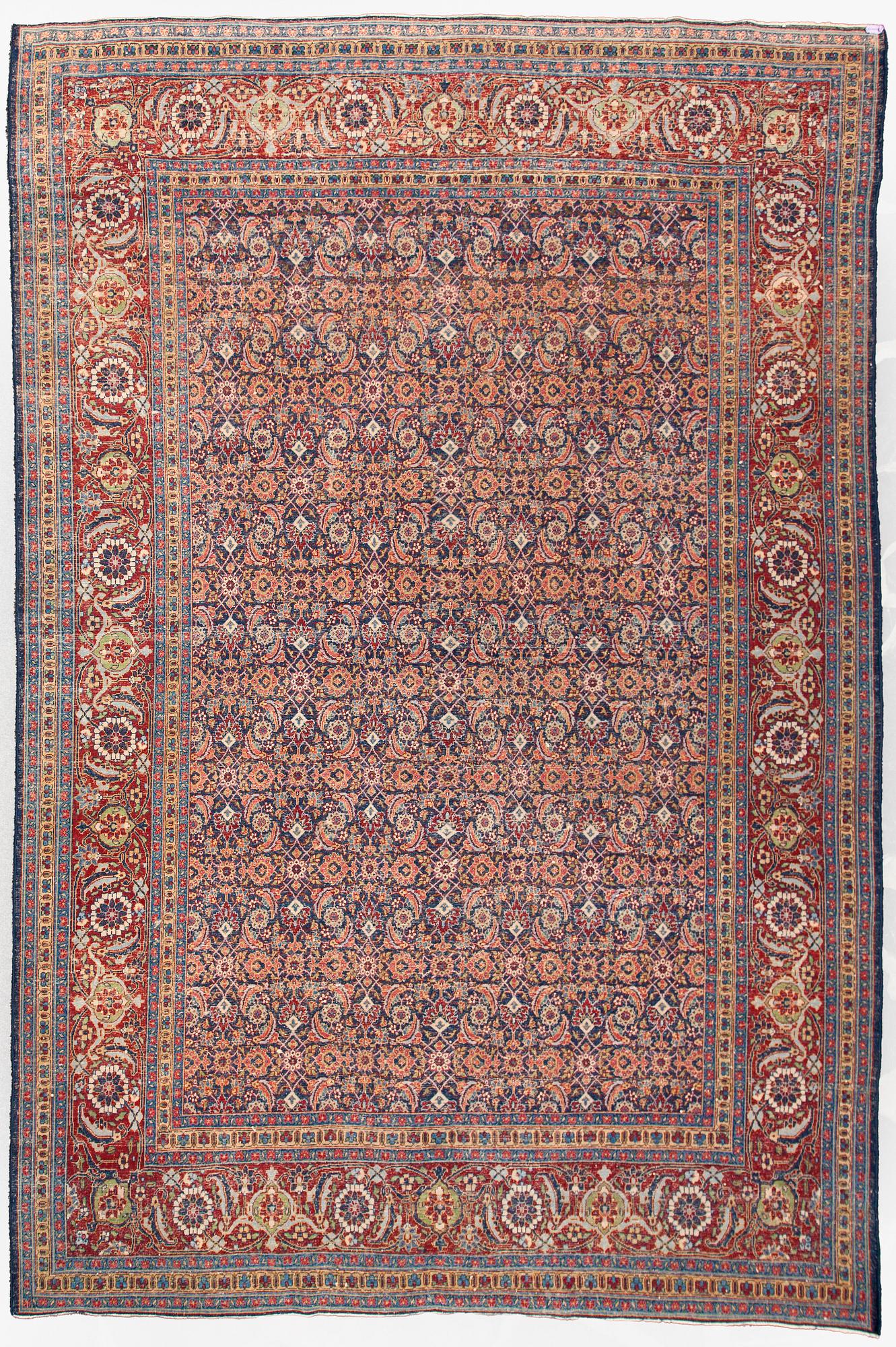 A carpet, a semi-antique Tabriz, ca 357 x 255 cm.