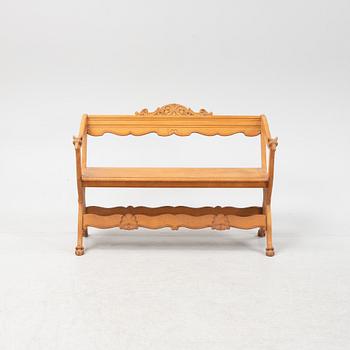 A carved oak sofa, circa 1900.