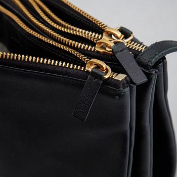 Céline, a black leather 'Trio Bag'.