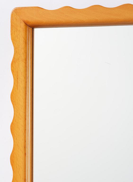 Swedish Modern, a wall mirror with wave-shaped frame, 1940s.
