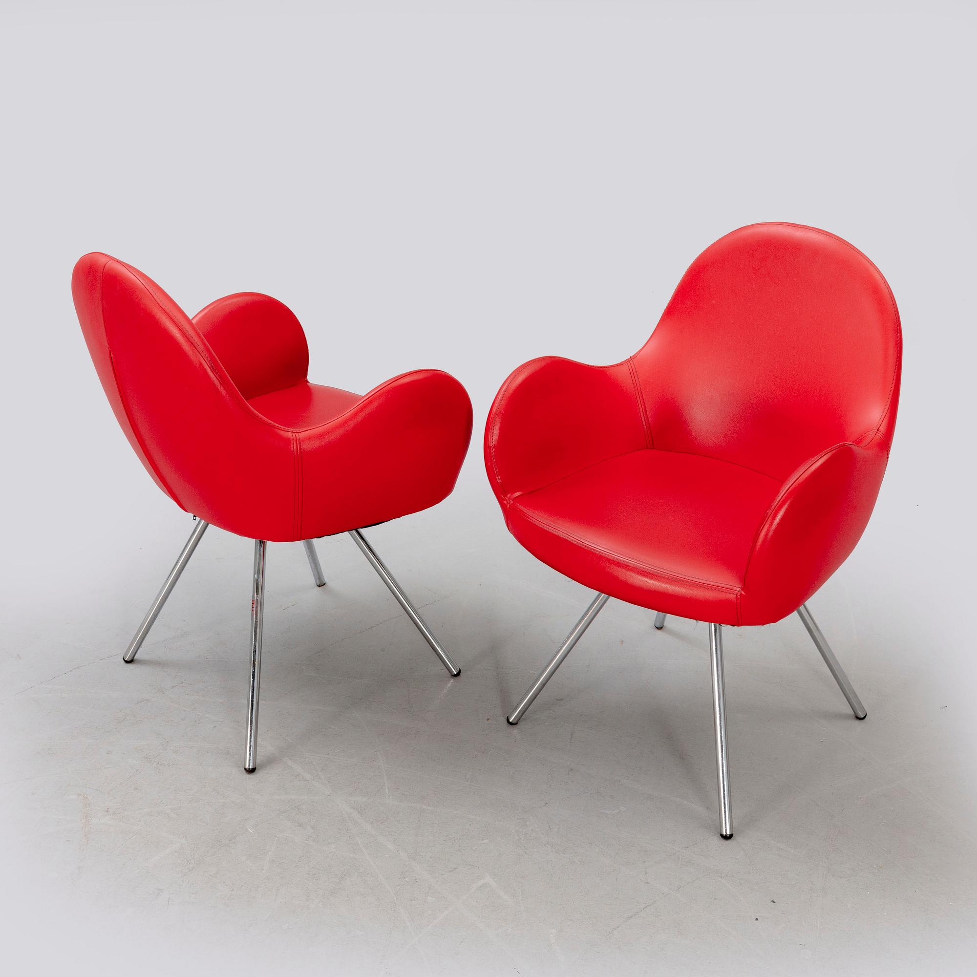 A pair of MB Sedie leather armchairs later part of the 20th century.