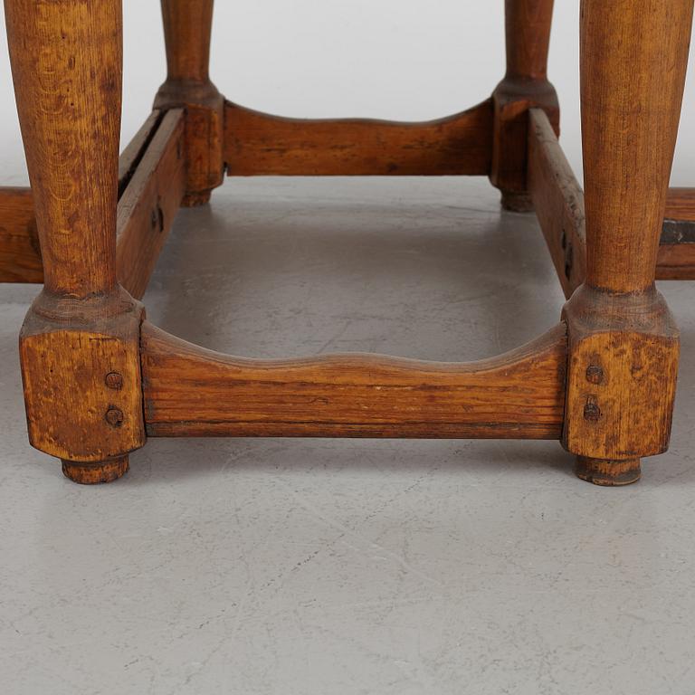 A drop-leaf table, 18th Century.